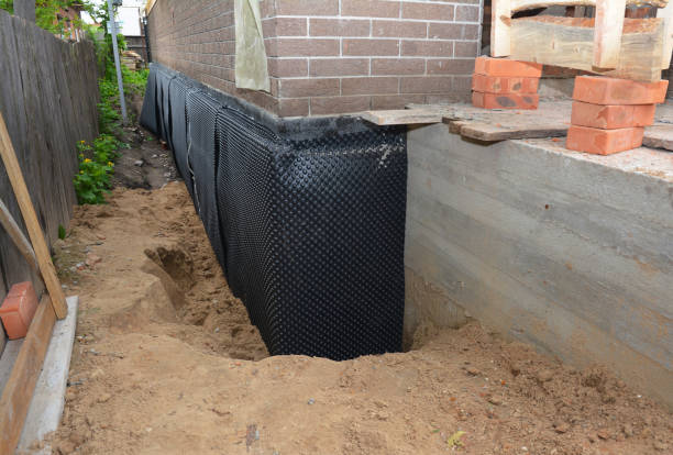 Happy homeowners after waterproofing job in Gainesville